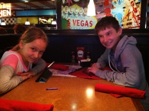 The kids waiting for dinner at  TGIFriday's inside Hotel Breakers
